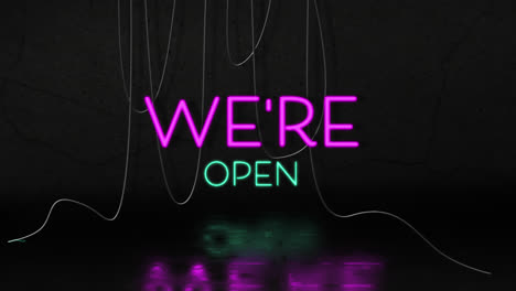 Animation-of-we're-open-text-in-pink-and-blue-neon,-with-hanging-cables-on-black-background