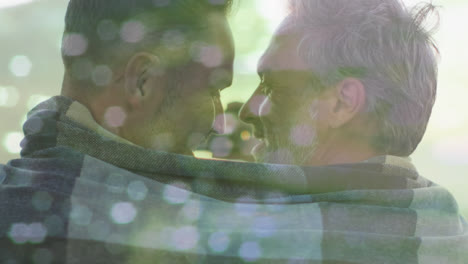 Animation-of-light-spots-over-happy-caucasian-male-gay-couple