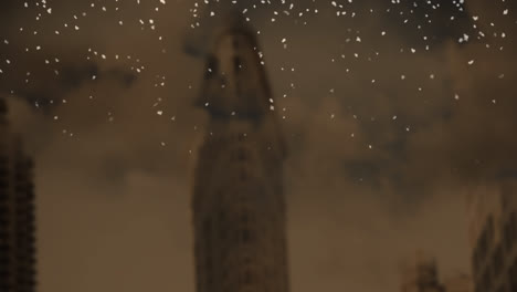 Animation-of-snow-falling-over-cityscape-on-brown-background