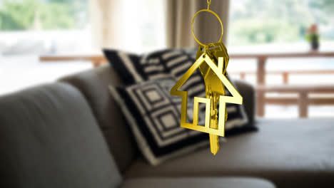Animation-of-gold-key-and-house-key-ring-over-blurred-house-interior