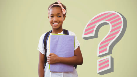 Animation-of-striped-question-mark-over-smiling-african-american-schoolgirl-holding-books,-on-beige