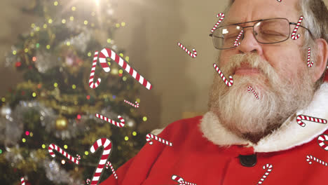 Animation-of-candy-canes-falling-over-santa-drinking-milk-at-christmas