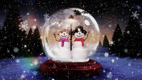 Snowflakes-falling-over-snowman-and-snowwoman-in-a-snow-globe-on-winter-landscape