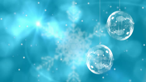 Animation-of-christmas-balls-over-snowflakes-on-blue-background