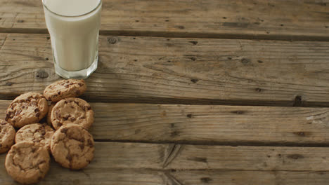 Video-of-biscuits-with-chocolate-and-milk-on-wooden-background
