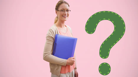 Animation-of-green-question-mark-over-smiling-caucasian-female-student-holding-books,-on-pink