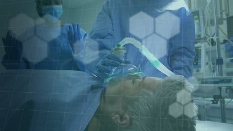 Animation-of-flashing-hexagons-over-surgeon-giving-mask-to-senior-female-patient-on-operating-table