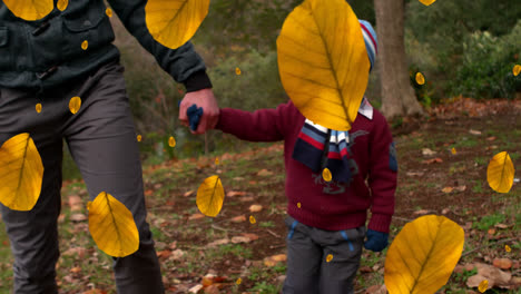 Animation-of-autumn-leaves-falling-over-happy-caucasian-boy-with-father-in-park