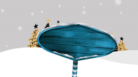 Blaues-Hölzernes-Schild-Gegen-Schnee,-Der-über-Weihnachtsbaumsymbole-Auf-Winterlandschaft-Fällt