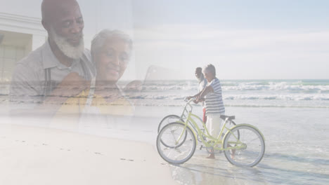 Zusammengesetztes-Bild-Eines-Glücklichen-Seniors,-Der-Zu-Hause-Einen-Laptop-Benutzt-Und-Am-Strand-Mit-Dem-Fahrrad-Unterwegs-Ist