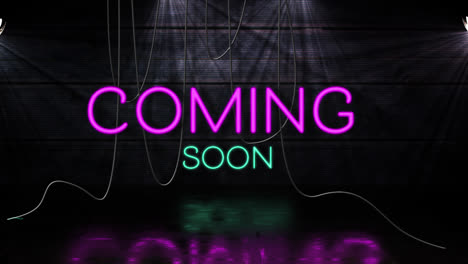 Animation-of-coming-soon-text-in-pink-and-blue-neon,-with-hanging-cables-on-black-background