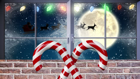 Candy-cane-icon-over-fairy-lights-over-window-frame-against-snow-falling-on-winter-landscape