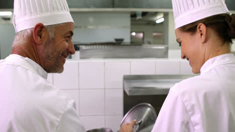 Two-chefs-talking-and-smiling-at-camera