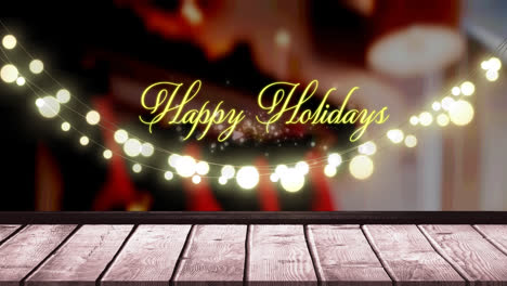Happy-holidays-text-and-glowing-yellow-fairy-light-decoration-hanging-over-wooden-plank