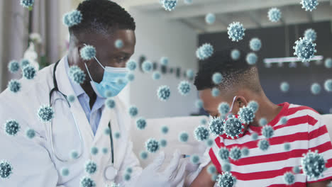 Animation-of-covid-19-cells-over-african-american-boy-in-face-mask-receiving-vaccination