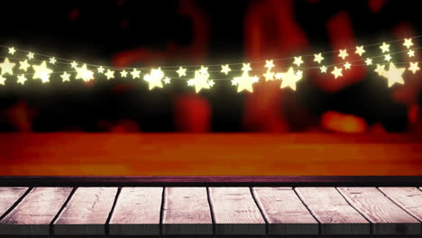 Animation-of-fairy-lights-and-over-wooden-boards