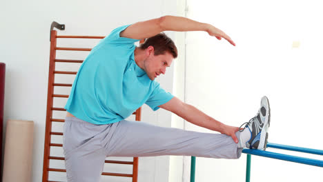 Flexible-man-stretching-his-leg