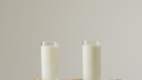 Video-of-biscuits-with-chocolate-and-milk-on-white-background