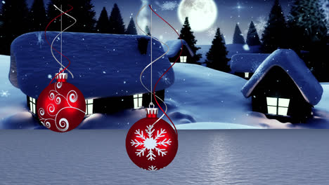 Snow-falling-over-christmas-bauble-hanging-decorations-against-winter-landscape-and-night-sky