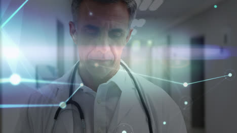 Animation-of-network-of-connections-over-caucasian-senior-male-doctor-using-tablet