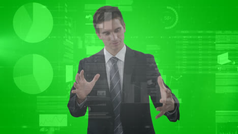 Animation-of-graphs,-data-and-caucasian-businessman-using-green-touchscreen