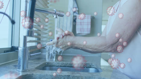Animation-Von-Covid-19-Zellen-über-Einem-älteren-Mann,-Der-Sich-Die-Hände-Wäscht