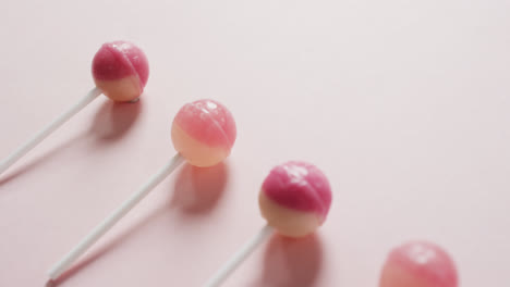 Video-of-pink-lollipops-on-pink-background