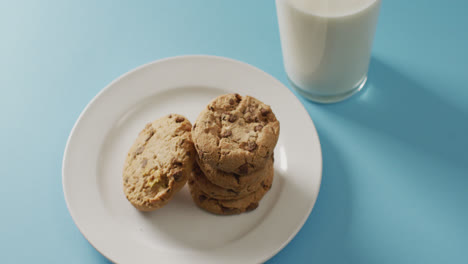 Video-of-biscuits-with-chocolate-and-milk-on-blue-background