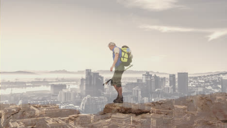 Composite-of-caucasian-senior-man-hiking-on-mountain,-and-modern-cityscape