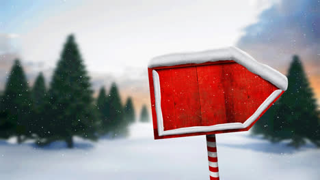 Animation-of-snow-falling-and-north-pole-sign-with-copy-space-over-winter-scenery