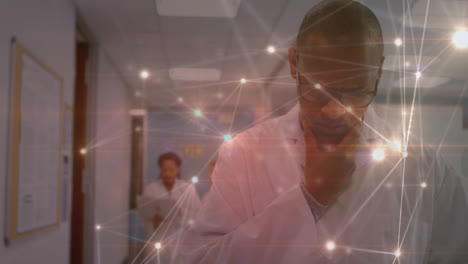 Animation-of-network-of-connections-over-biracial-male-doctor