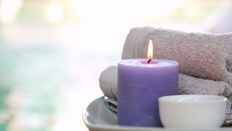 Beauty-treatment-in-bowl-presented-on-plate-with-candle