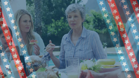 Animation-of-stripes-with-stars-over-three-generation-caucasian-women-eating-in-garden