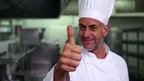 Head-chef-giving-thumbs-up-and-smiling-at-camera