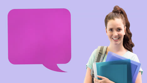 Animation-of-pink-speech-bubble-over-smiling-caucasian-teenage-female-student-with-books,-on-lilac