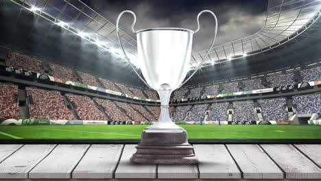 Animation-of-silver-cup-in-sports-stadium