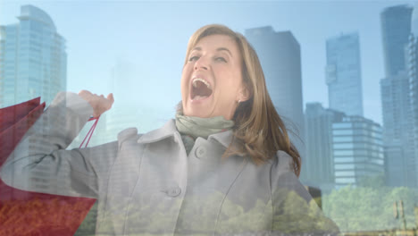 Composite-of-laughing-caucasian-woman-holding-shopping-bags,-and-modern-cityscape
