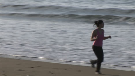 Woman-Jogging-on-Beach