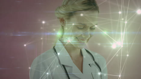 Animation-of-network-of-connections-over-happy-caucasian-female-doctor