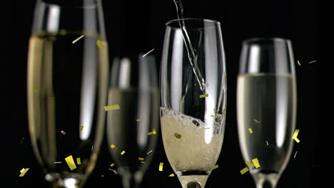 Animation-of-gold-confetti-falling-over-chmpagne-glasses-on-black-background