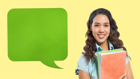 Animation-of-green-speech-bubble-over-smiling-asian-teenage-female-student-holding-books,-on-yellow