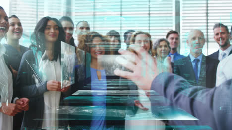 Animation-of-data-on-screens-over-diverse-male-and-female-business-colleagues-clapping-hands