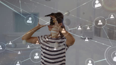 Animation-of-network-of-connections-over-biracial-woman-using-vr-headset