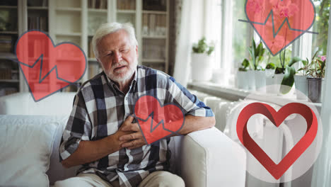 Animation-of-heart-icons-over-senior-caucasian-man-in-pain-holding-his-chest