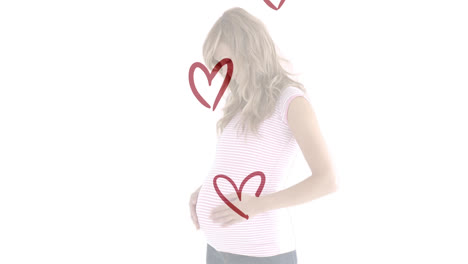 Animation-of-red-hearts-over-smiling-pregnant-caucasian-woman