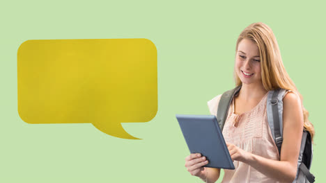 Animation-of-yellow-speech-bubble-over-caucasian-teenage-female-student-using-tablet,-on-green