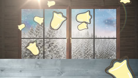 Multiple-chritsmas-bell-icons-falling-over-wooden-plank-and-window-frame-against-winter-landscape