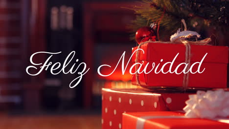 Animation-of-feliz-navidad-over-christmas-presents-and-tree