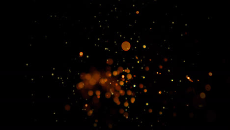 Animation-of-spots-of-light-and-golden-dots-falling-on-black-background