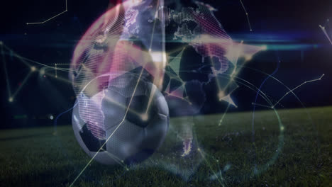 Animation-of-globe-rotating-over-legs-of-male-soccer-player